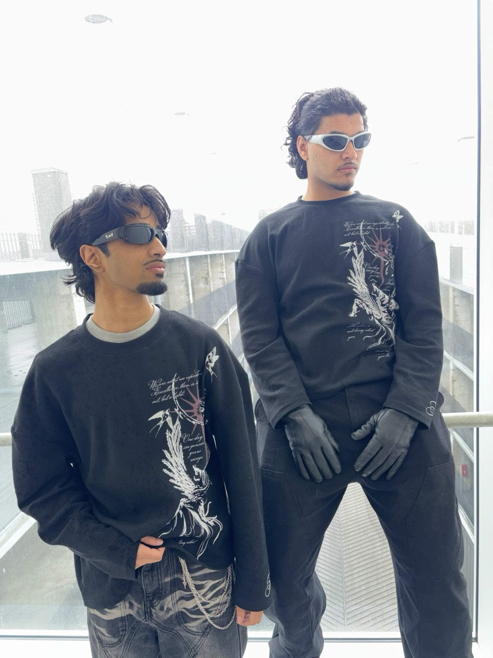 Two models wearing Aurelius Collection graphic thermals